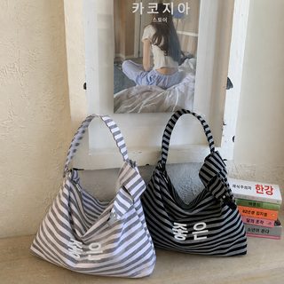 나른한 바람 스트라이프 캔버스 가방 2026 신상 여자 알파벳 프린트 대용량 통근 백합 원룸 토트 가방